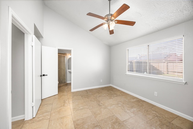 unfurnished bedroom with ceiling fan, vaulted ceiling, and a textured ceiling