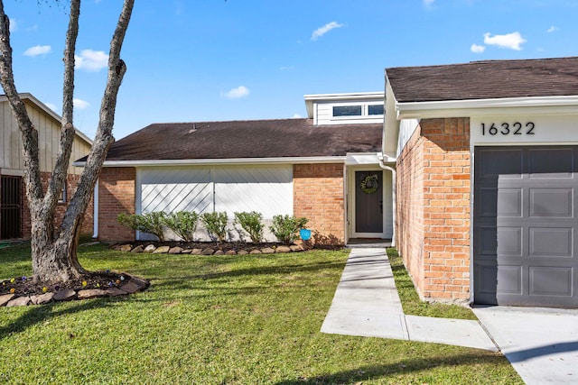 view of exterior entry with a lawn