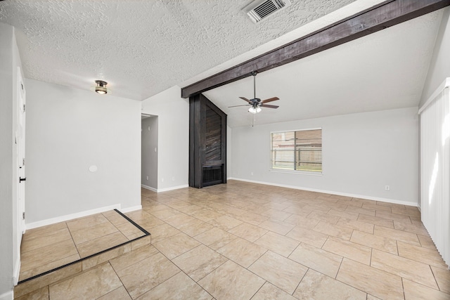 unfurnished living room featuring ceiling fan, light tile patterned floors, a textured ceiling, and vaulted ceiling with beams