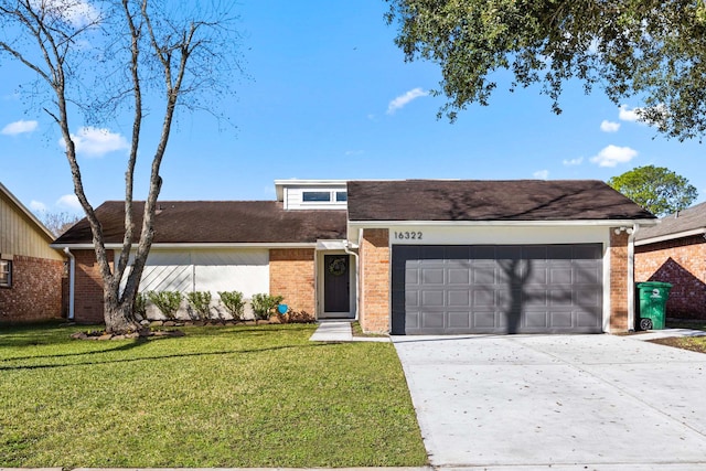 view of front of house featuring a garage and a front lawn