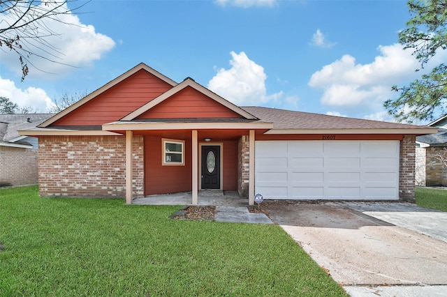 view of front of home with a garage and a front yard