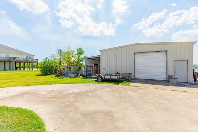 garage with a lawn