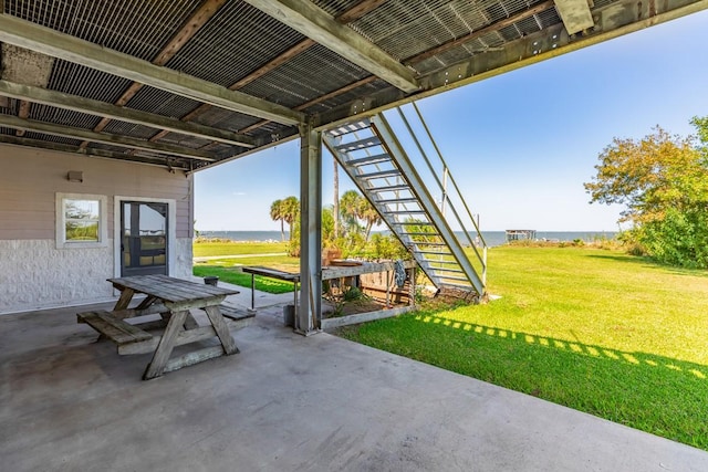 view of patio featuring a water view