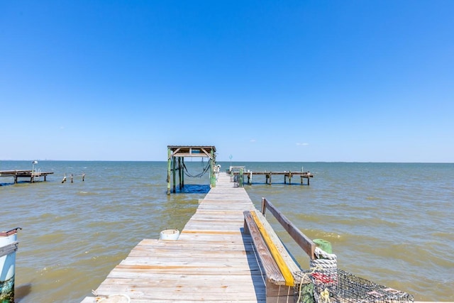 dock area featuring a water view