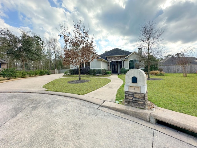 ranch-style house with a front yard