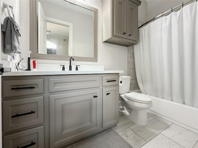 full bathroom featuring marble finish floor, shower / tub combo, vanity, and toilet