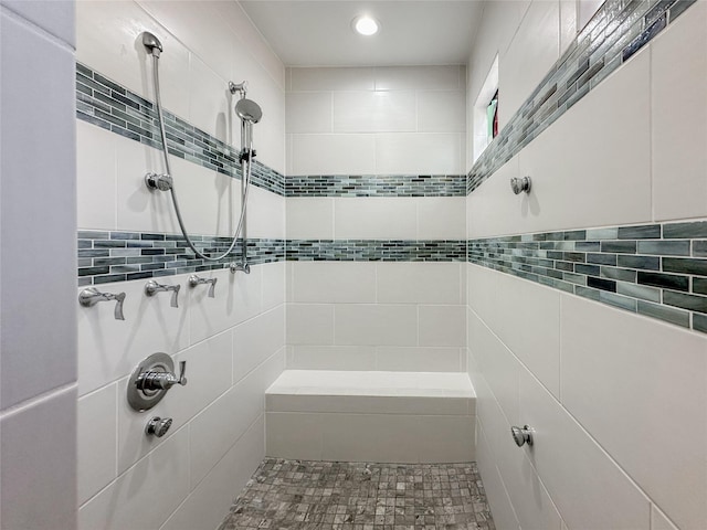 full bathroom with a tile shower