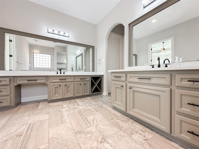 full bath featuring two vanities and a sink