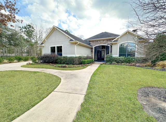 single story home featuring a front yard