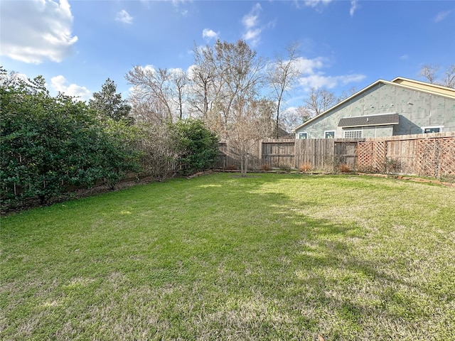 view of yard with a fenced backyard