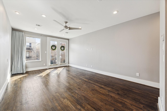 spare room featuring dark wood-type flooring, french doors, and ceiling fan