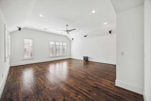 unfurnished living room with dark wood-type flooring, ceiling fan, and lofted ceiling