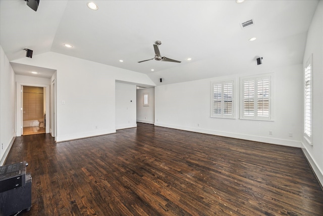 unfurnished room featuring dark wood-type flooring, ceiling fan, and vaulted ceiling