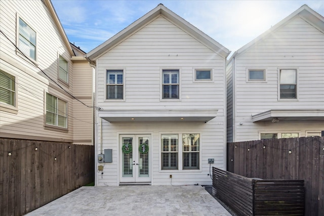 rear view of house featuring a patio and french doors