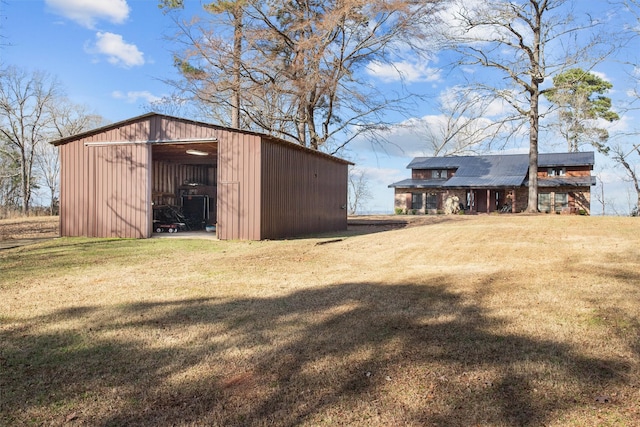 view of pole building with a yard