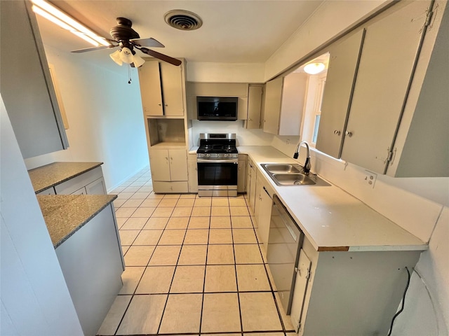 kitchen with sink, ceiling fan, dishwasher, gas stove, and light tile patterned flooring