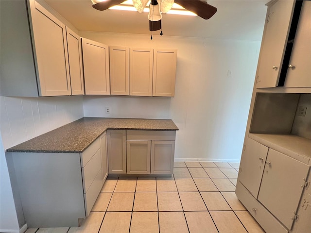 kitchen featuring gray cabinetry, light tile patterned floors, and ceiling fan