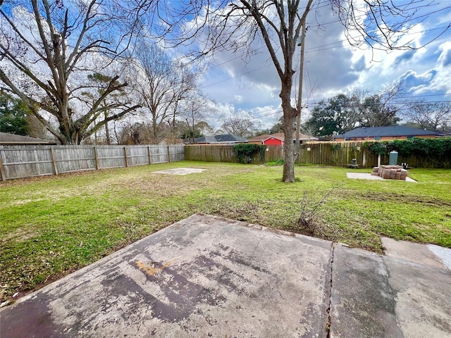 view of yard with a fire pit and a patio area