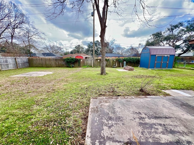 view of yard featuring a storage shed and a patio