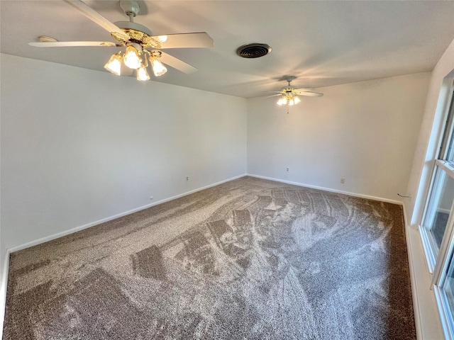 carpeted empty room with ceiling fan