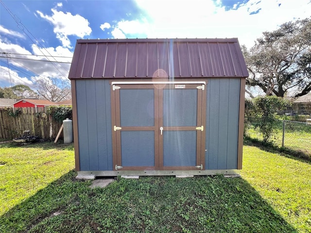 view of outdoor structure with a yard