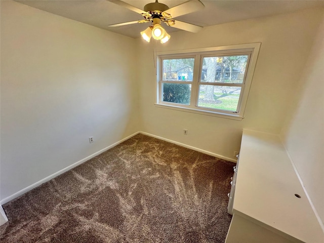 spare room featuring carpet flooring and ceiling fan