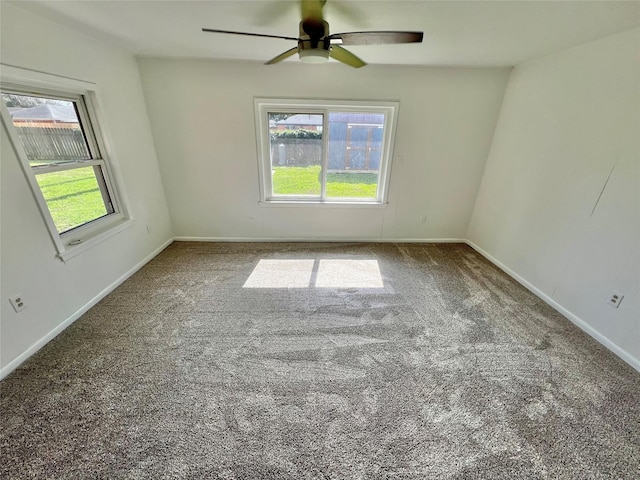 carpeted empty room with ceiling fan