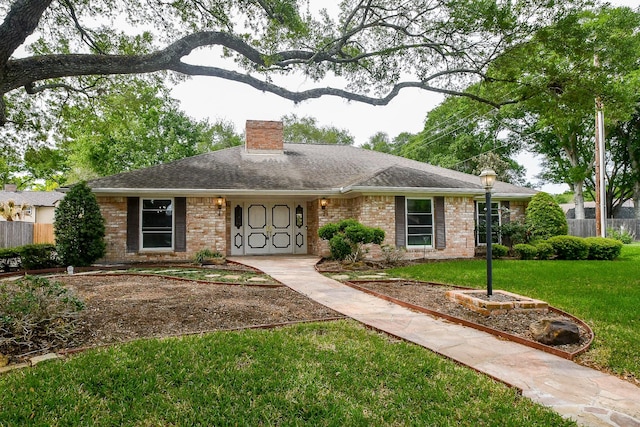 ranch-style house with a front lawn