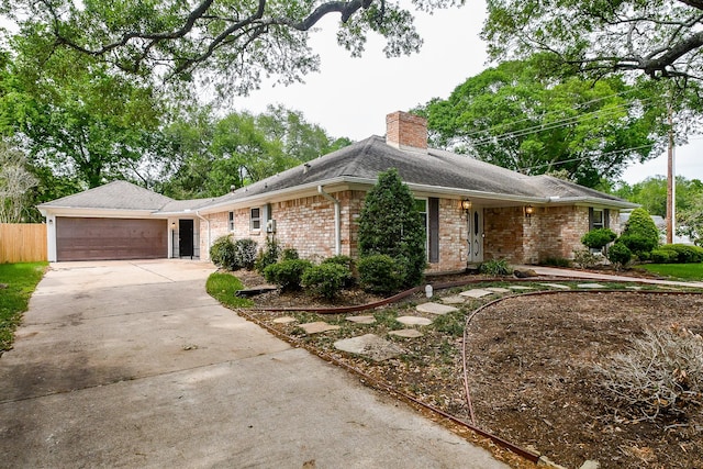 single story home featuring a garage