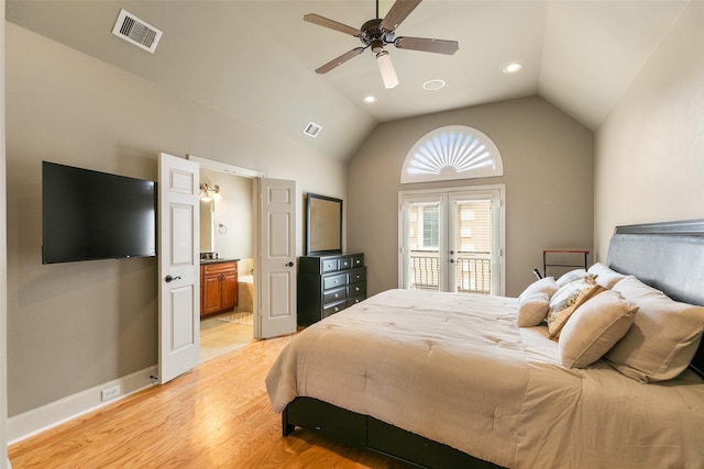 bedroom featuring vaulted ceiling, ensuite bath, access to exterior, ceiling fan, and light wood-type flooring