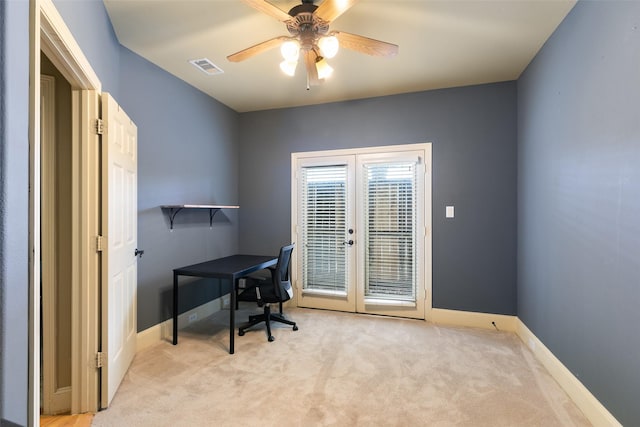 home office with light carpet, french doors, and ceiling fan