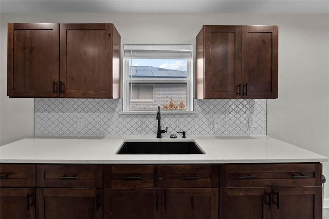 kitchen featuring sink and decorative backsplash