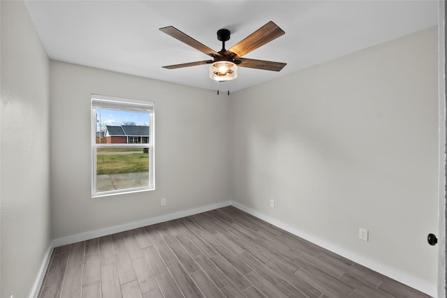 empty room featuring hardwood / wood-style floors and ceiling fan