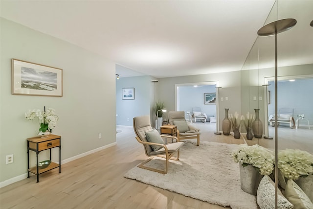 sitting room with light hardwood / wood-style flooring