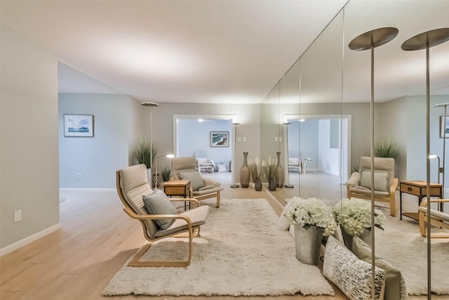 living area with light hardwood / wood-style flooring