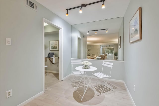 corridor featuring light hardwood / wood-style flooring