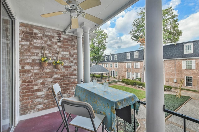 view of patio / terrace featuring a bar and ceiling fan