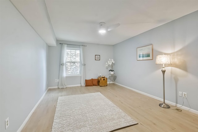 interior space with hardwood / wood-style floors and ceiling fan