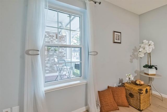 sitting room with hardwood / wood-style flooring