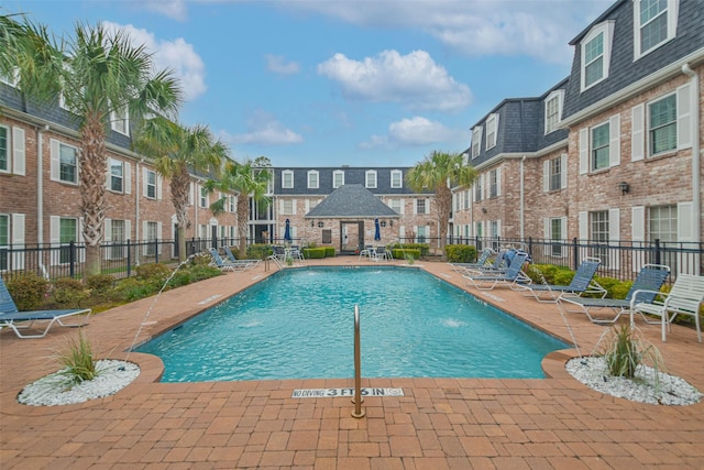 view of pool featuring a patio and pool water feature