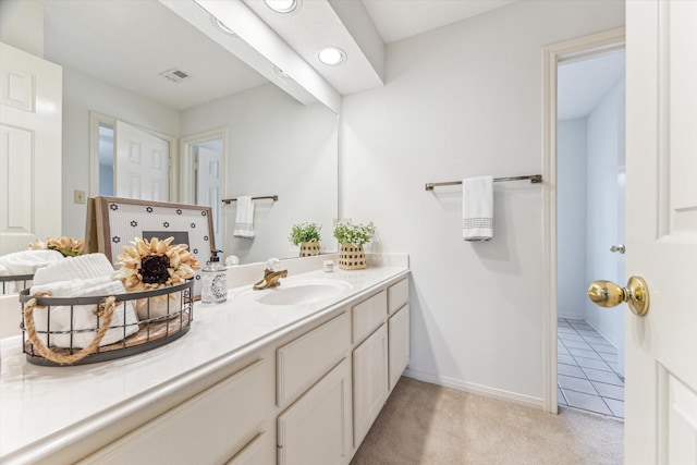 bathroom featuring tile patterned flooring and vanity