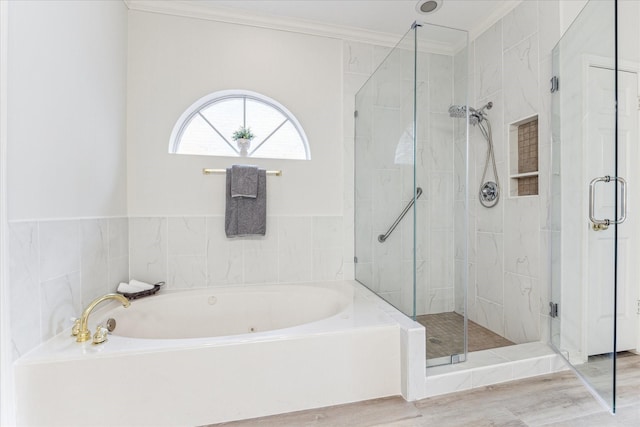 bathroom featuring hardwood / wood-style flooring, ornamental molding, and plus walk in shower