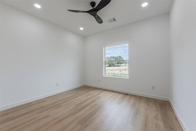 unfurnished room with ceiling fan and light hardwood / wood-style floors