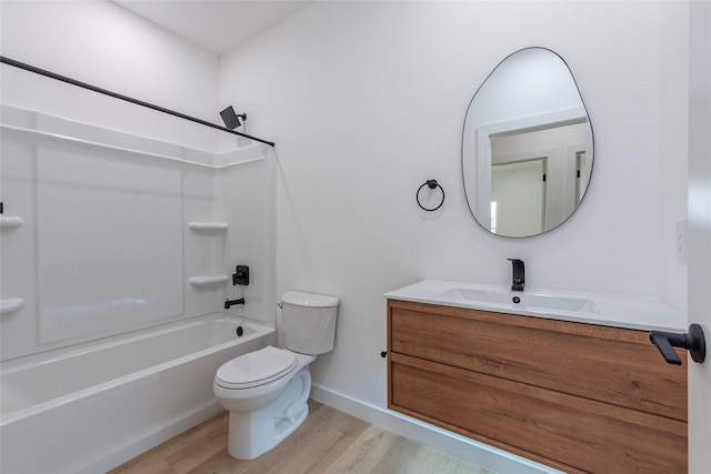 full bathroom with vanity, hardwood / wood-style floors, bathing tub / shower combination, and toilet