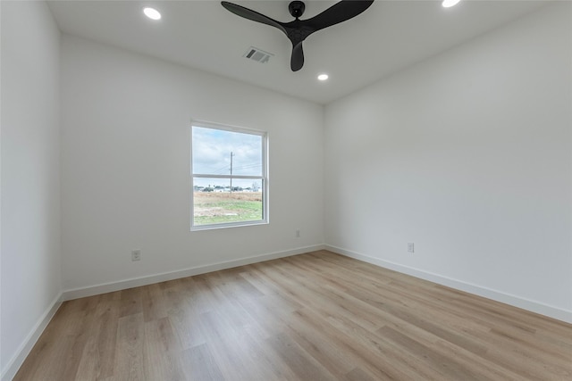 unfurnished room with ceiling fan and light hardwood / wood-style flooring