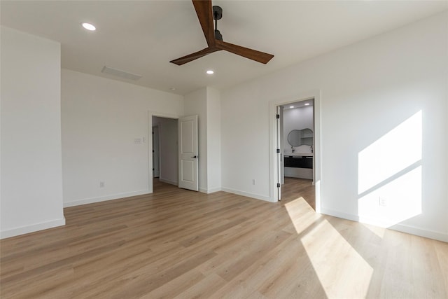 unfurnished room with ceiling fan and light hardwood / wood-style flooring