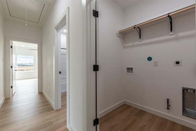 laundry room featuring hookup for a washing machine, gas dryer hookup, hookup for an electric dryer, and light hardwood / wood-style flooring