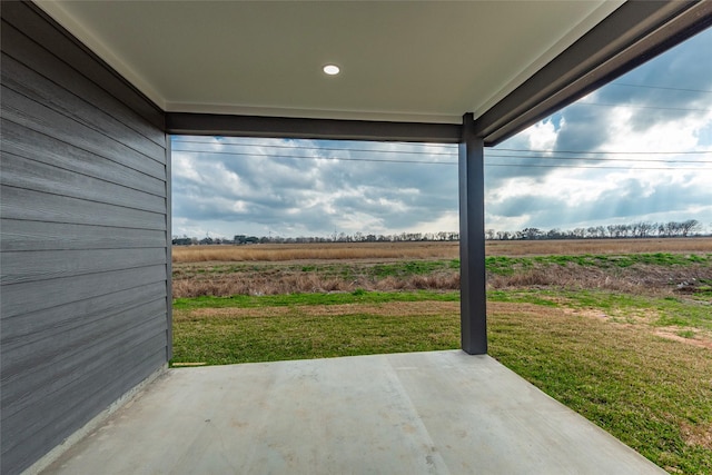 view of patio / terrace featuring a rural view