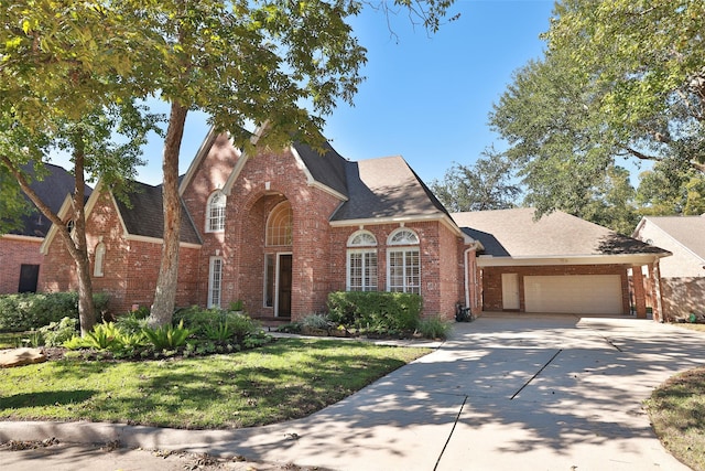 view of front of house featuring a garage and a front lawn