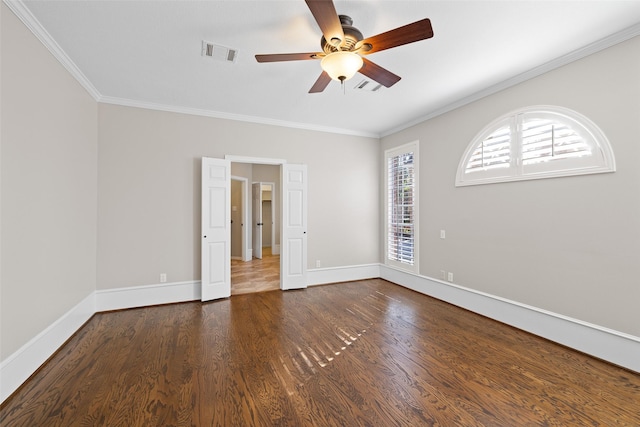 empty room with crown molding, dark hardwood / wood-style floors, and ceiling fan